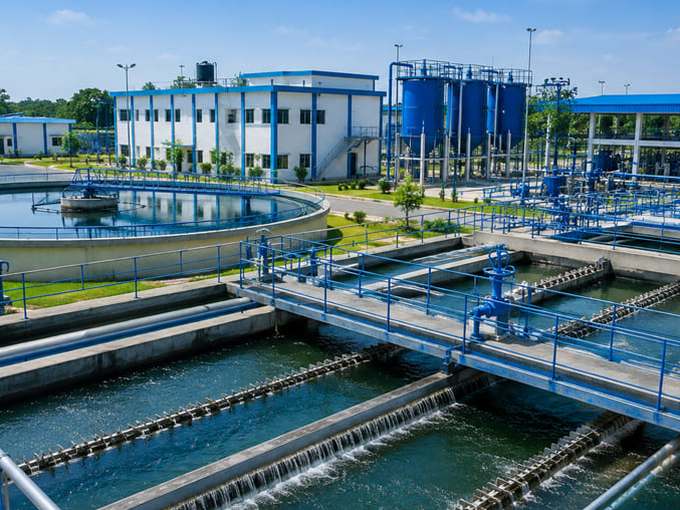 Water treatment plant with clarifiers and pump house — pumping scheduled around tariff windows and tank levels